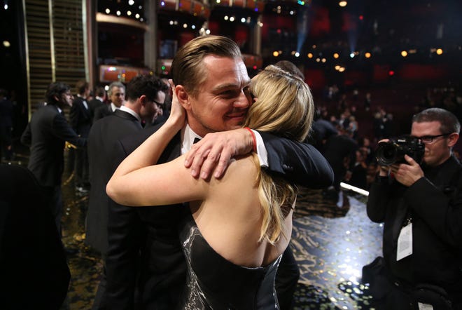 Leonardo DiCaprio, winner of the award for best actor in a leading role for "The Revenant", left, embraces Kate Winslet backstage at the Oscars on Sunday, Feb. 28, 2016, at the Dolby Theatre in Los Angeles.