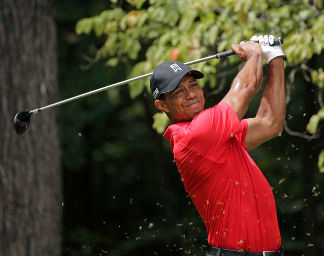 Tiger Woods watches his tee shot on the second hole during the final round of the Wyndham Championship on Aug. 23 at Sedgefield Country Club in Greensboro, N.C. (AP Photo/Chuck Burton)