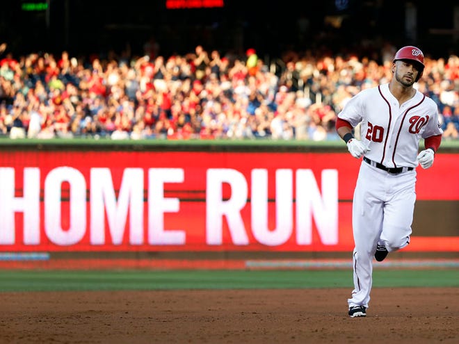 In this June 20, 2014 file photo, Washington Nationals' Ian Desmond rounds the bases after hitting a solo home run during the second inning of a baseball game against the Atlanta Braves at Nationals Park in Washington. Desmond, a Sarasota High graduate, signed with the Texas Rangers.