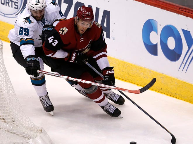 In this Oct. 2, 2015, file photo, Arizona Coyotes left wing Matthias Plachta (43) shields San Jose Sharks left wing Barclay Goodrow in the third period during a preseason NHL hockey game, in Glendale, Ariz. The Arizona Coyotes and Pittsburgh Penguins kicked off NHL trade deadline day by making a small deal over breakfast, Monday, Fed. 29, 2016. A source told The Associated Press that the Coyotes have acquired winger Sergei Plotnikov from the Penguins in exchange for prospect Matthias Plachta and a conditional seventh-round pick in 2017. The source spoke on condition of anonymity because the teams hadnâ€™t announced the deals.