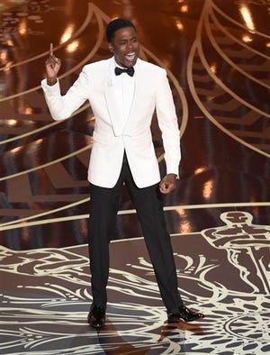 FILE - In this Feb. 28, 2016 file photo, host Chris Rock speaks at the Oscars at the Dolby Theatre in Los Angeles. The Nielsen company said Tuesday that an estimated 3.22 million black viewers watched the Oscars on ABC Sunday, a decline of 2 percent from the 2015 show. The show's overall viewership of 34.4 million was an eight-year low, and a drop of nearly 8 percent from the year before.