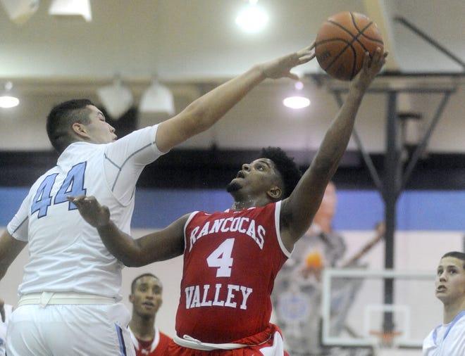 Rancocas Valley's Adam Perry is fouled by Shawnee's Drew Brennan during a South Jersey Group 4 game Tuesday, March 1, 2016.