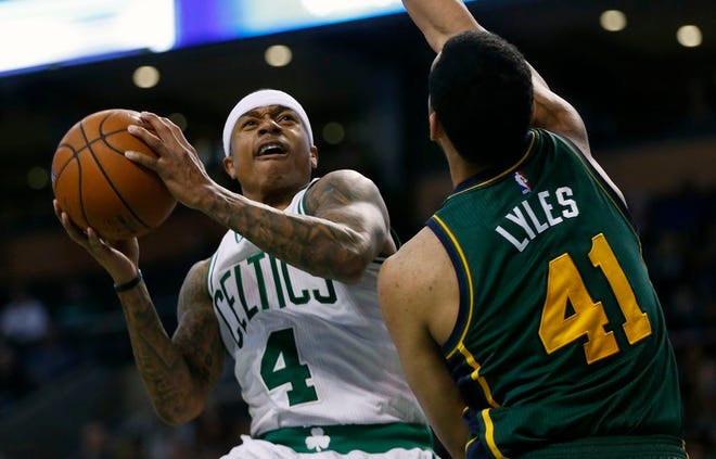 Boston Celtics' Isaiah Thomas shoots against Utah Jazz's Trey Lyles during the third quarter of an NBA basketball game in Boston, Monday, Feb. 29, 2016. The Celtics won 100-95.