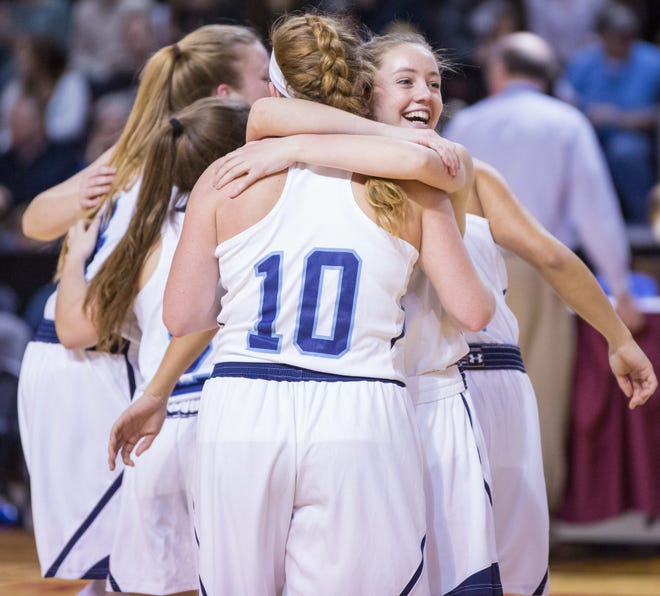 Members of the state champion York High School girls basketball team react after Saturday's 58-57 win over Lawrence in the Class A final. Christopher Lambert Photo