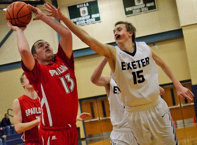 Exeter High School’s Alex Price (15) contests the shot of Spaulding’s Reece Paquette during Monday’s Division I boys basketball game at Exeter. Ryan O’Leary/Seacoastonline