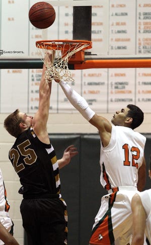 Shelby's Dax Hollifield shoots over East Lincoln's Chazz Surratt during their 85-53 loss to the Mustangs Tuesday night. (John Clark/Halifax Media Services)