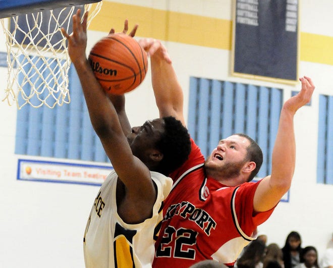 Florence's Femi Adebowale (12) gets inside against as Keyport's Travis Alvarez (22), who gets a hand on the ball during a Central Jersey Group 1 boys basketball game Wednesday at Florence.
