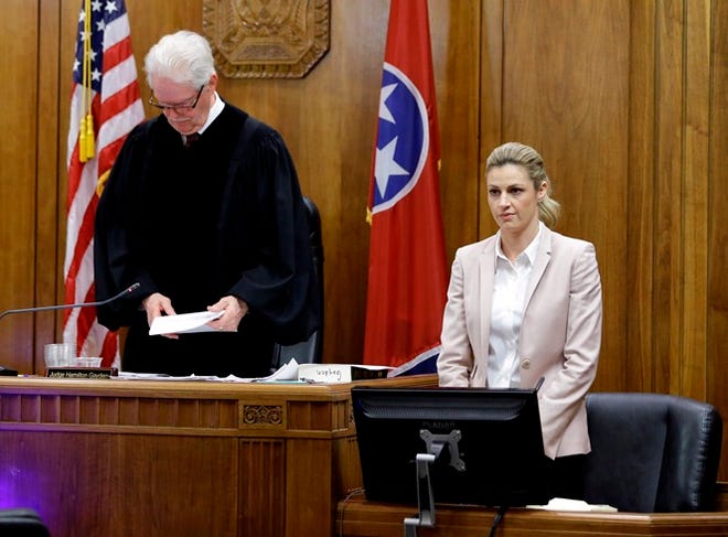 Sportscaster and television host Erin Andrews stands as the jury enters the courtroom before she resumes her testimony Tuesday in Nashville, Tennessee.