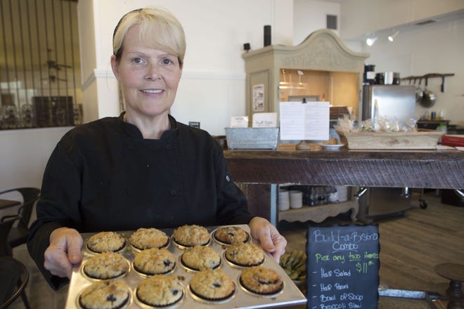 Head Chef Jill Anderson shows off her freshly baked blueberry muffins at the Small Batch Bistro in Eustis.