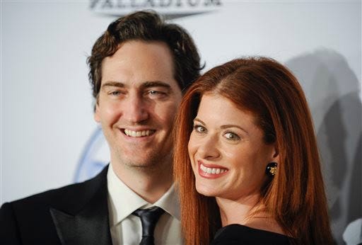 In a 2009 photo, producer Daniel Zelman and actress Debra Messing arrive at the Producers Guild Awards in Los Angeles. AP Photo / Gus Ruelas, File