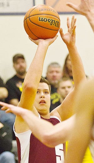 Annawan's Dalton Coppejans shoots and scores on a long 2-pointer during the Braves' Class 1A sectional semifinal with Lena-Winslow Wednesday night at River Ridge High School.