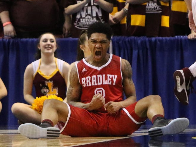 Bradley guard Antoine Pittman reacts after scoring while being fouled by a Loyola of Chicago player during the first half of an NCAA college basketball game in the Missouri Valley Conference men's tournament Thursday, March 3, 2016, in St. Louis. (Chris Lee/St. Louis Post-Dispatch via AP)