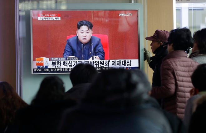 People watch a TV news program showing North Korean leader Kim Jong Un, at Seoul Railway Station in Seoul, South Korea, Thursday, March 3, 2016. North Korea fired several short-range projectiles into the sea off its east coast Thursday, Seoul officials said, just hours after the U.N. Security Council approved the toughest sanctions on Pyongyang in two decades for its recent nuclear test and long-range rocket launch. The screen reads "Sanction on the North Korea." (AP Photo/Ahn Young-joon)