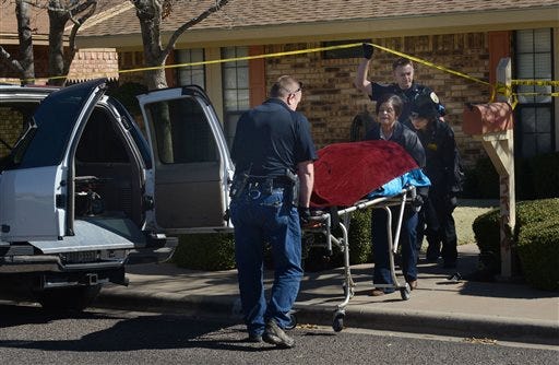 Investigators with the Ector County Medical Examiners Office remove one of two bodies that were found shot to death in their home Wednesday, March 2, 2016, in a residential neighborhood of Odessa, Texas. Odessa police charged 17-year-old James Gabriel McDonald with capital murder in the early morning shooting deaths of his parents, 52-year-olds Jana Lou McDonald and James Gregory McDonald.