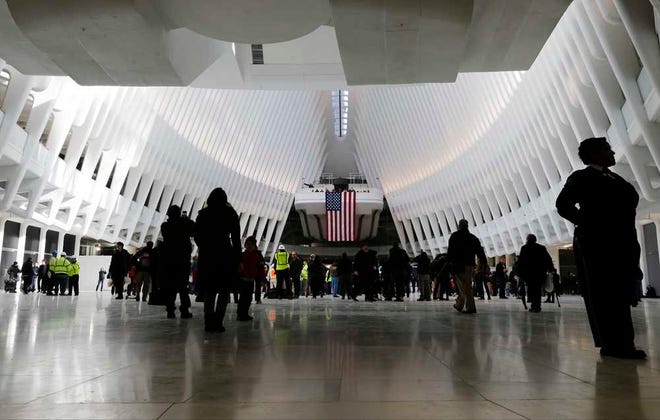 A security guard stand near the entrance to the Oculus Thursday, March 3, 2016, in New York. New Yorkers and tourists get their first look inside the cathedral-like hall that sits atop the new $4 billion train station at the World Trade Center. (AP Photo/Frank Franklin II)