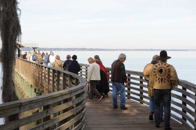 The attendees form a procession leading to the St. Johns River for the conclusion of the blessing ceremony.