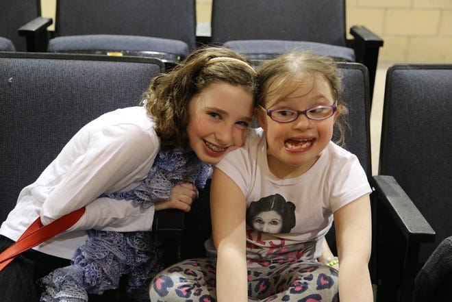 Zoe, 10 (left) and Violet, 8 (right) Morrison paid the Middleborough School Committee a visit to introduce the Special Olympics' "Spread the word, end the word" last Thursday night.