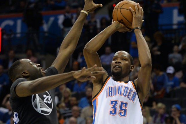 Oklahoma City Thunder forward Kevin Durant (35) shoots the ball against Golden State Warriors forward Draymond Green (23) during the fourth quarter at Chesapeake Energy Arena in Oklahoma City on Saturday, Feb. 27, 2016. (Mark D. Smith-USA TODAY Sports)