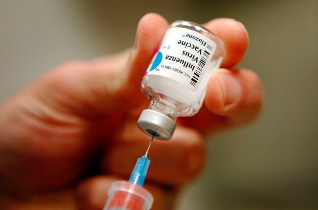 A nurse prepares an injection of the influenza vaccine at Massachusetts General Hospital in Boston in January 2013. The Oklahoma Department of Health reports that five residents have died since flu season began in October. (REUTERS/Brian Snyder/Files)