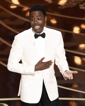 Host Chris Rock speaks at the Oscars on Sunda at the Dolby Theatre in Los Angeles. Chris Pizzello/Invision