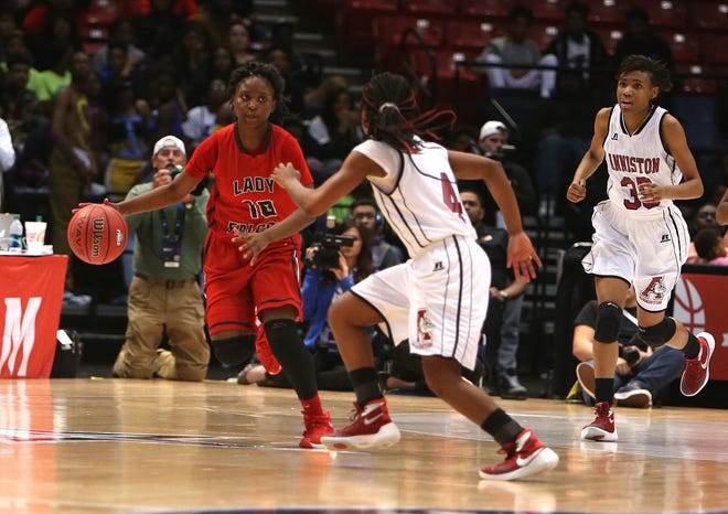 Central-Tuscaloosa's Traniya Pitts dribbles the ball downcourt guarded by Anniston's Raven Cooley during the AHSAA girls basketball class 5A semi-final game against Anniston High School held at the BJCC Legacy Arena in Birmingham, Ala. on Wednesday March 2, 2016. Central-Tuscaloosa won the game 39-37 and will play Saturday morning. staff photo/Erin Nelson