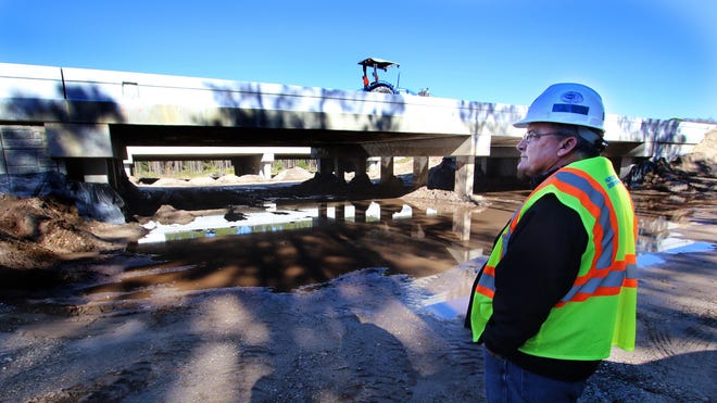 Steve Wigle checks out the wildlife underpasses underneath Interstate 4 designed for bears and other animals to safely cross under the highway. News-Journal/JIM TILLER