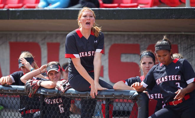 The Texas Tech dugout cheers for their team during the first inning. Texas Tech played McNeese State in softball in Lubbock Saturday, March 5, 2016. (Allison Terry/AJ Media)