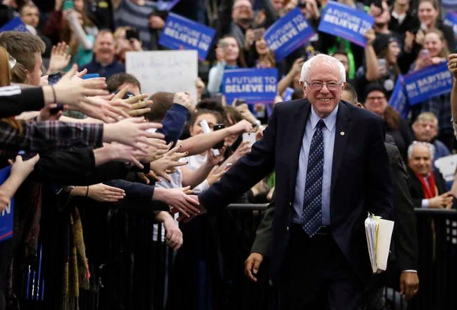Democratic presidential candidate, Sen. Bernie Sanders, I-Vt, greets supporters before speaking at a rally at the Macomb Community College, Saturday, March 5, 2016, in Warren, Mich. (AP Photo/Carlos Osorio)