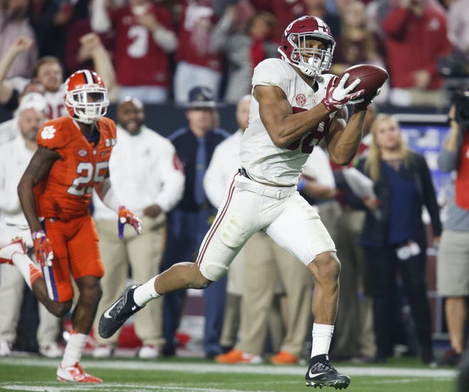 Alabama tight end O.J. Howard (88) catches a pass and runs for a touchdown behind Clemson cornerback Cordrea Tankersley (25) during Alabama's 45-40 victory over Clemson in the College Football National Championship game in the University of Phoenix Stadium Monday, January 11, 2016. Staff Photo | Gary Cosby Jr.