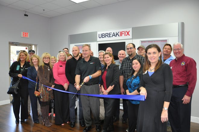 UBreakIFix has opened for business at 5521 S. Williamson Blvd., Suite 425, Port Orange, and recently held a ribbon cutting with the Ormond Beach Chamber of Commerce. The store specializes in electronics repair and is open 10 a.m.-7 p.m., Monday through Saturday, and noon-5 p.m., Sunday. They can be reached at 386-872-7886. Pictured from left: Kathy Smith, Skip Keating, Susan Dye, Peggy Farmer, Mary Smith, Carlene Despard, Jeremiah Poff, Joe Markiewicz, Riff Fernberg, Jan Markiewicz, Tom Caffrey, Bob Sneyers, Hector Cruz, Don Howard, Yashia Cruz, Billie Jo Kaler, Dann Dragone and Rick Fraser. PHOTO COURTESY OF ORMOND BEACH CHAMBER OF COMMERCE
