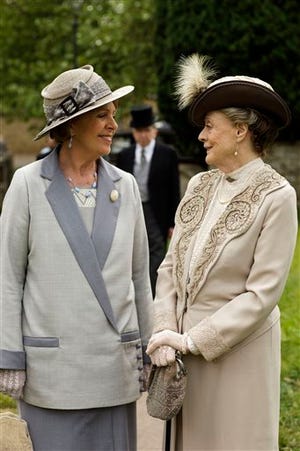 This image released by PBS shows Penelope Wilton as Isobel Crawley, left, and Maggie Smith as Violet, Dowager Countess of Grantham in a scene from the final season of "Downton Abbey." The series finale airs in the U.S. on Sunday. (Nick Briggs/Carnival Film & Television Limited 2015 for MASTERPIECE via AP)
