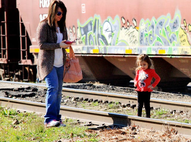 Jamie Mitchell • Times Record
With a train car as her backdrop, Alyssa McChristian, 3, strikes a pose Saturday, March 5, 2016, for an impromptu photo shoot with her mother, Tina McChristian of Tulsa, as they wait for the A&M excursion train at the Trolley Museum.