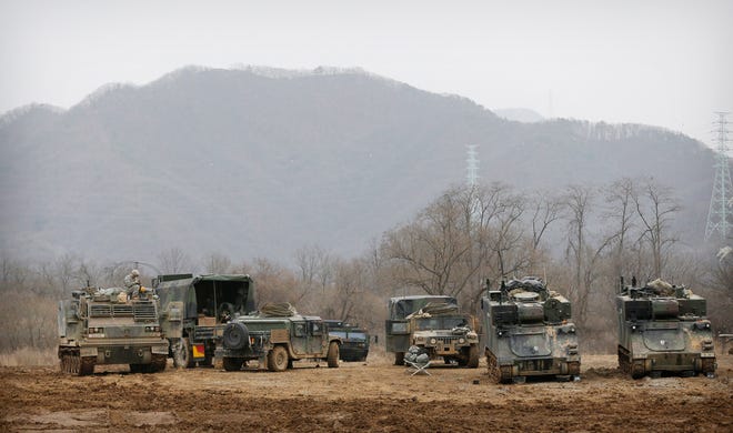 FILE - In this Monday, March 7, 2016, file photo, U.S. Army's armored vehicles take on a position during an annual exercise in Yeoncheon, near the border with North Korea. Massive joint U.S.-South Korea military exercises are a spring ritual on the Korean Peninsula guaranteed to draw a lot of threat-laced venom from Pyongyang. (AP Photo/Ahn Young-joon, File)
