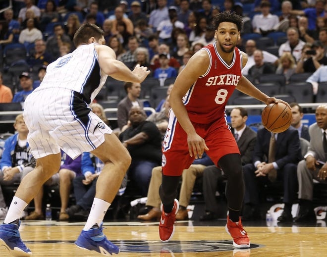 Sixers rookie center Jahlil Okafor (8) drives toward Magic center Nikola Vucevic (9) during a Feb. 28, 2016, game in Orlando.