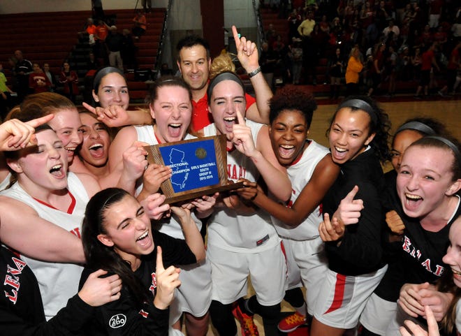 Members of the Lenape girls basketball team celebrate after defeating Cherokee to win the South Jersey Group 4 championship Tuesday, March 8, 2016.