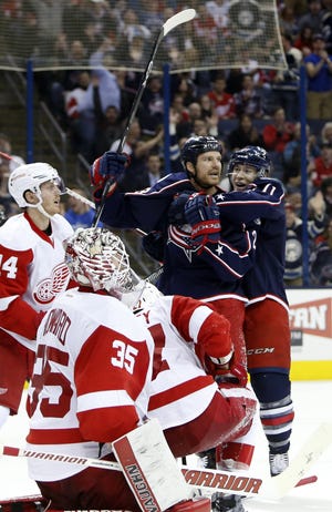Columbus Blue Jackets' Matt Calvert, right, and David Clarkson celebrate their goal against the Detroit Red Wings during the second period of an NHL hockey game, Tuesday, March 8, 2016, in Columbus, Ohio. (AP Photo/Jay LaPrete)