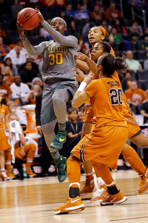 Baylor's Alexis Jones, left, takes the ball to the hoop during the Big 12 Women's Basketball Championships final against Texas at Chesapeake Energy Arena in March. [PHOTO BY NATE BILLINGS, THE OKLAHOMAN]