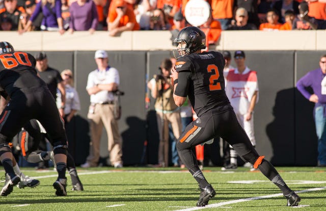 Oklahoma State Cowboys quarterback Mason Rudolph (2) looks to pass against the Texas Christian University Horned Frogs during the first half at Boone Pickens Stadium in Stillwater, Okla., on Saturday, Nov. 7, 2015. (Rob Ferguson-USA TODAY Sports)