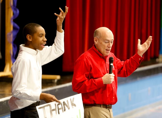 Meteorologist James Spann makes a presentation to students at Tuscaloosa Magnet School Tuesday, March 8, 2016. Student Brandon Walton gestures with Spann as he helps him during the presentation. Staff Photo/Gary Cosby Jr.