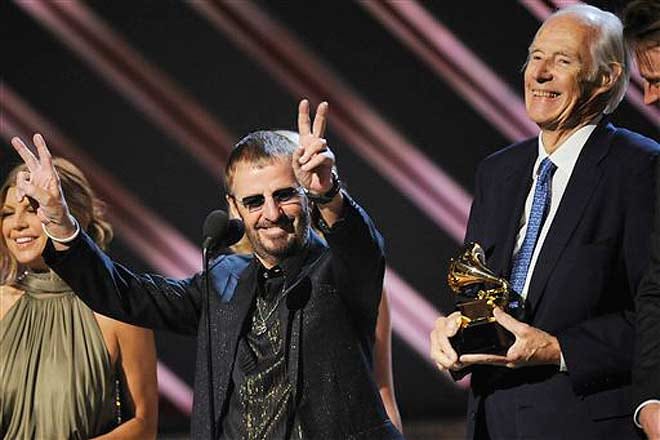 George Martin, right, accepts a 2008 Grammy award accompanied by Ringo Starr, center.