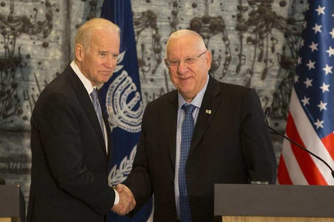 U.S. Vice President Joe Biden, left, shakes hands with Israel President Reuven Rivlin during a Wednesday meeting at the president's residence in Jerusalem.