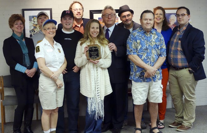 Ransdell, center, holds her plaque as cast and crew of her screenplay, The Bridge, surround her. Courtesy Photo