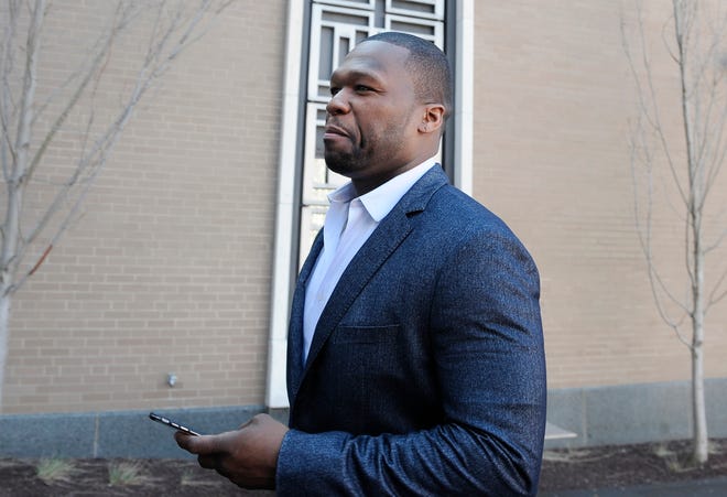 Curtis "50 Cent" Jackson arrives at court for a federal bankruptcy hearing Wednesday in Hartford, Conn. Jackson has been ordered to explain Instagram photos, with one depicting him next to piles of cash arranged to spell out "broke." Jackson filed for bankruptcy last year after a New York City jury ordered him to pay $7 million to a woman who said he posted her sex tape online.