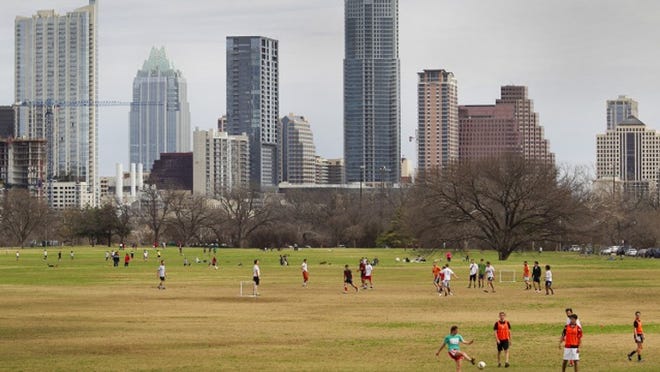2/10/13 Ralph Barrera/American-Statesman;The Great Lawn of Zilker Park is a haven for Austinites as several groups play mini-soccer, a smaller version of the bigger game played with small nets. The entrance to the park is free on weekends until March 8, when the city implements a $3.00 parking fee per car. (feature only)