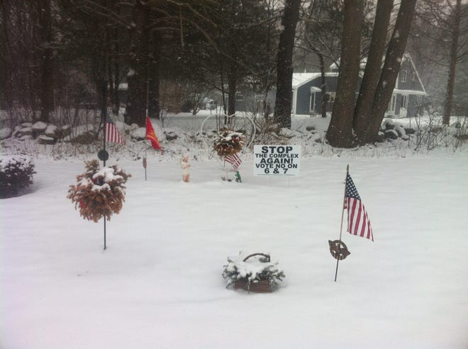Police are investigating after a sign in opposition to a new safety complex in North Hampton was placed on the grave of a North Hampton firefighter's daughter. Courtesy photo