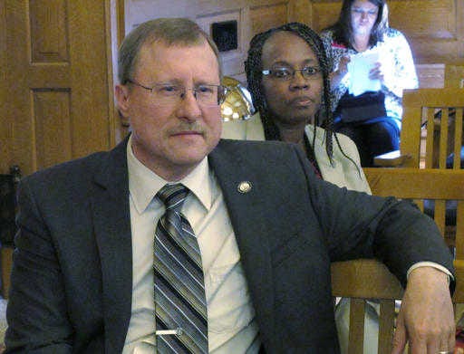 Kansas state Sen. Mitch Holmes, R-St. John, watches as the Senate Judiciary Committee debates and approves a bill declaring that state Supreme Court justices can be impeached for meddling too much in the state Legislature's business , Thursday, March 10, 2016, at the Statehouse in Topeka, Kan. Holmes is a sponsor of the bill and says it is necessary because the courts have a recent history of overreaching in their decisions.