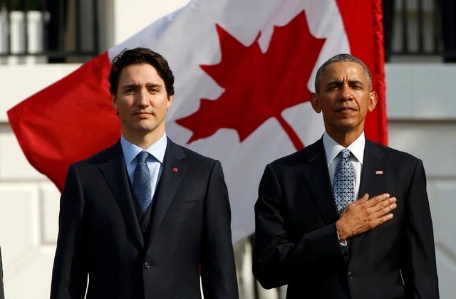 President Barack Obama and Canadian Prime Minister Justin Trudeau take part in an arrival ceremony for Trudeau at the White House in Washington March 10, 2016. (REUTERS/Kevin Lamarque)