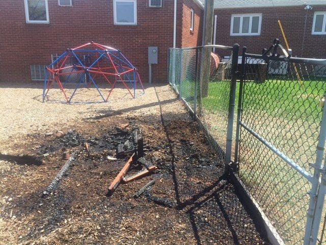 (File) Falls police and fire officials say a playhouse at the Restoration Church off Pinewood Drive was destroyed, and a cross set outside and a bathroom inside were also set on fire Sunday, April 19, 2015.