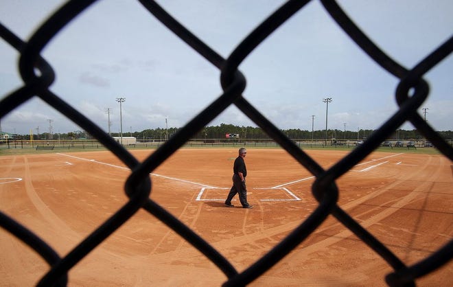 Baseball coach Jimmy Kelley looks over the newly renovated Field 1 at Frank Brown Park in Panama City Beach on Friday.