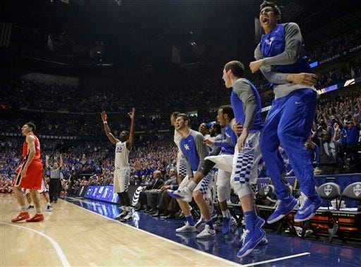 Kentucky players cheer a teammate's basket against Georgia during the second half of an NCAA college basketball game in the Southeastern Conference tournament in Nashville, Tenn., Saturday, March 12, 2016. (AP Photo/Mark Humphrey)
